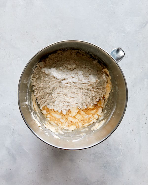 Snickerdoodle cookie dough in a bowl being mixed.