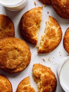 Snickerdoodle cookie recipe with two glasses of milk.