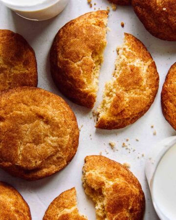 Snickerdoodle cookie recipe with two glasses of milk.