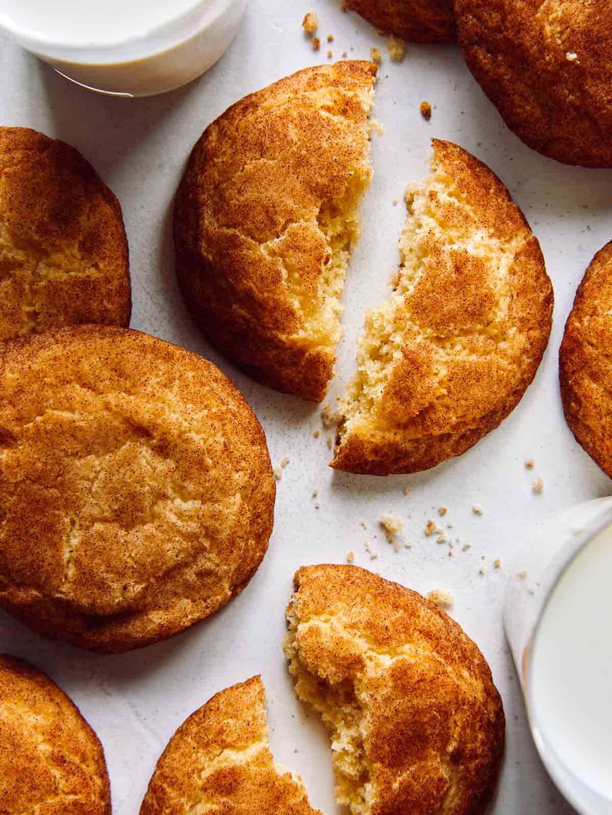 Snickerdoodle cookie recipe with two glasses of milk. 