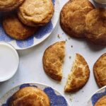 Snickerdoodle cookie recipe with some on plates and some milk.