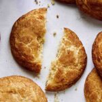 Snickerdoodle cookies broken in half.