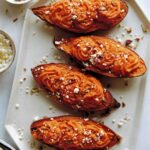 Twice baked sweet potatoes on a plate.