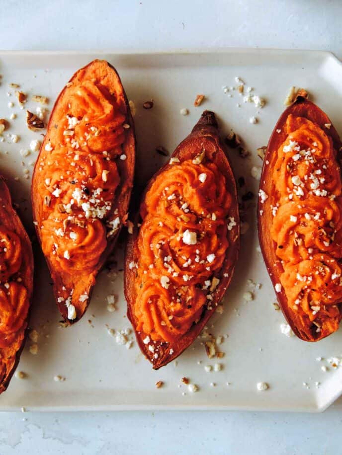 Twice baked sweet potatoes on a platter. 