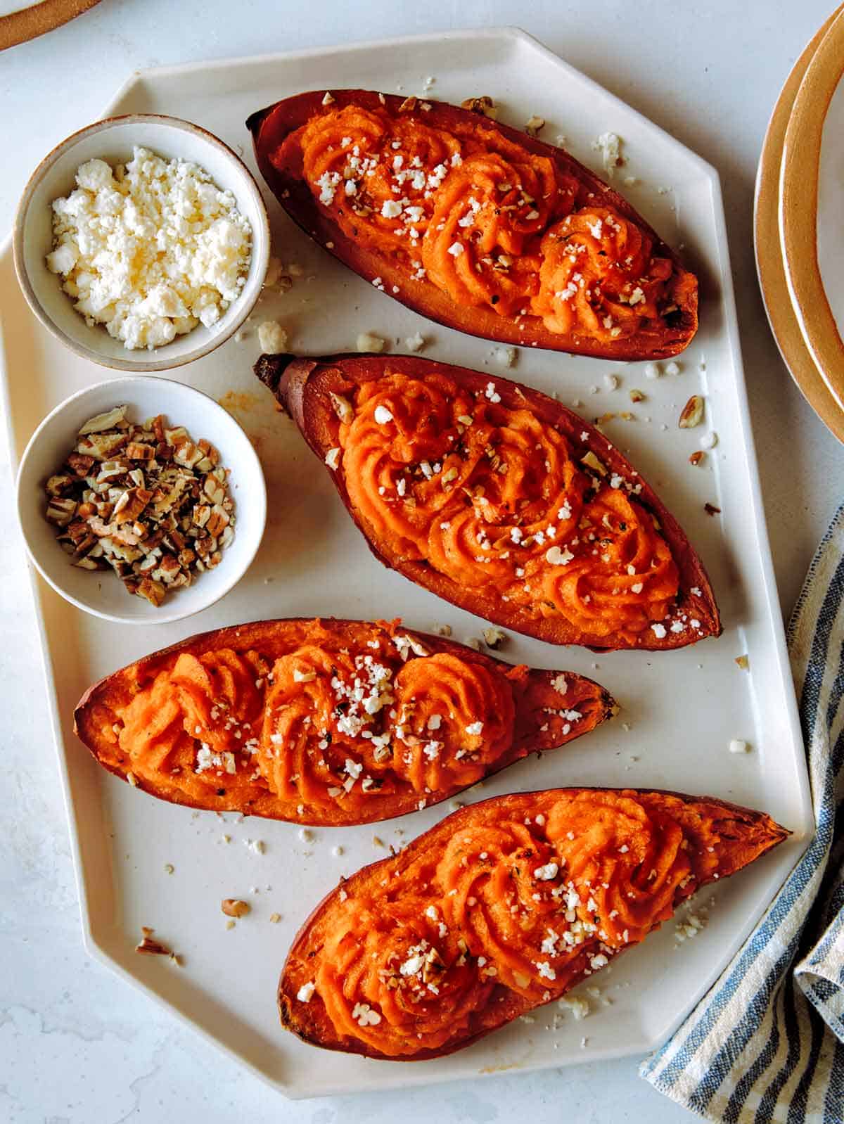 Twice baked sweet potatoes prepared and put on a platter.