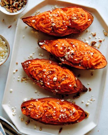 Twice baked sweet potatoes with feta and pecans on the side.