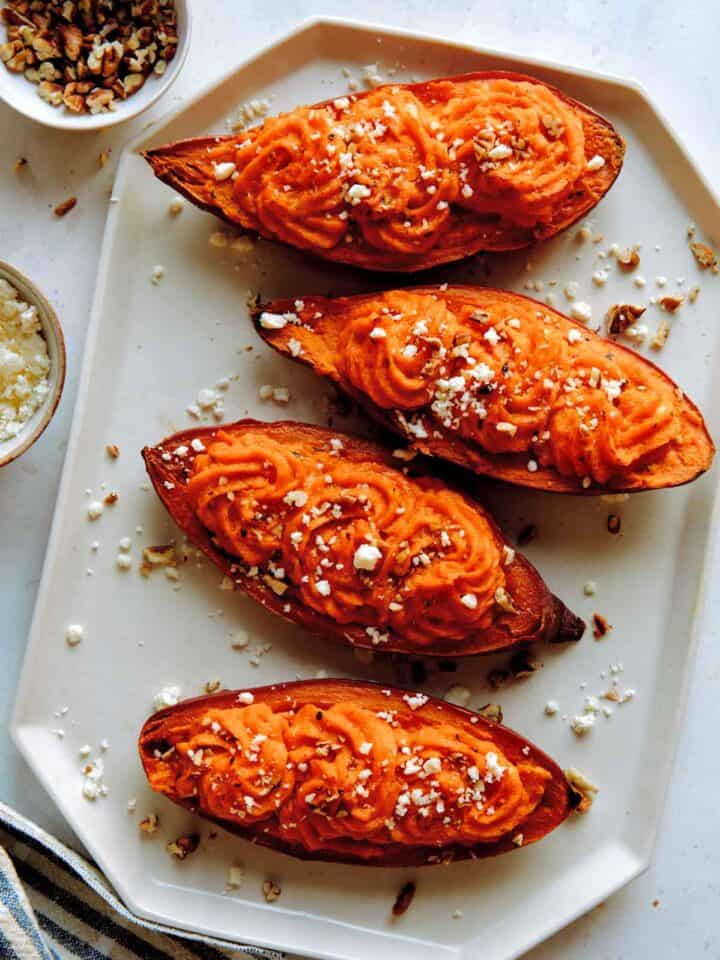 Twice baked sweet potatoes with feta and pecans on the side.