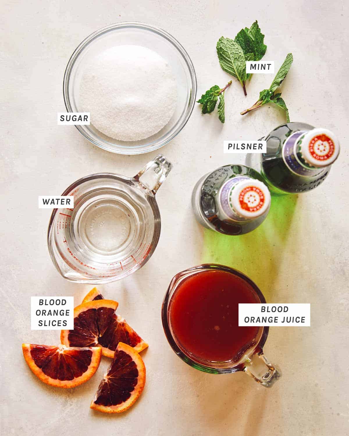 Blood Orange Shandy ingredients on a kitchen counter. 