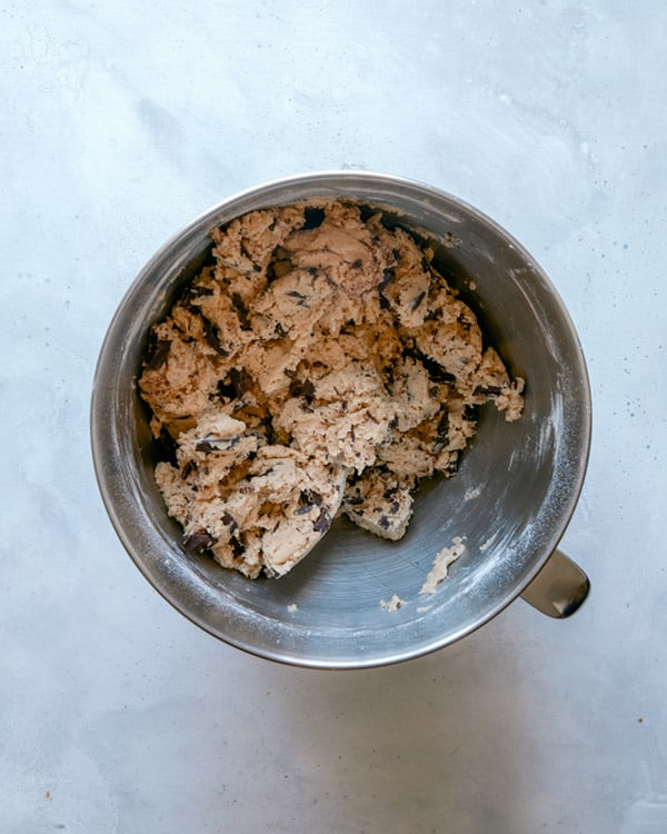 Chocolate chip cookie dough in a bowl.