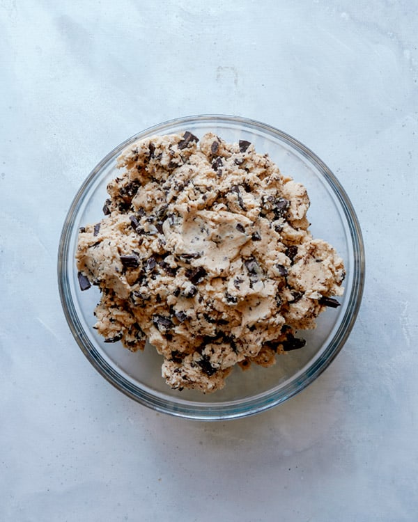Chocolate chip cookie dough in a bowl.