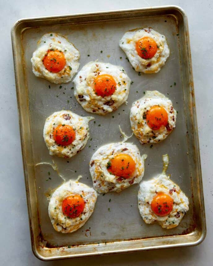 Egg clouds on a baking sheet seasoned.