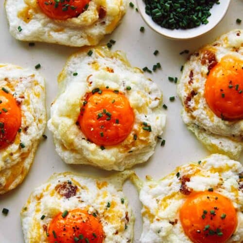 Cloud Eggs on a platter with slices chives.