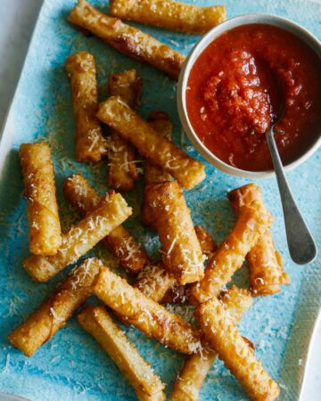Mozzarella sticks with a marinara dipping sauce.