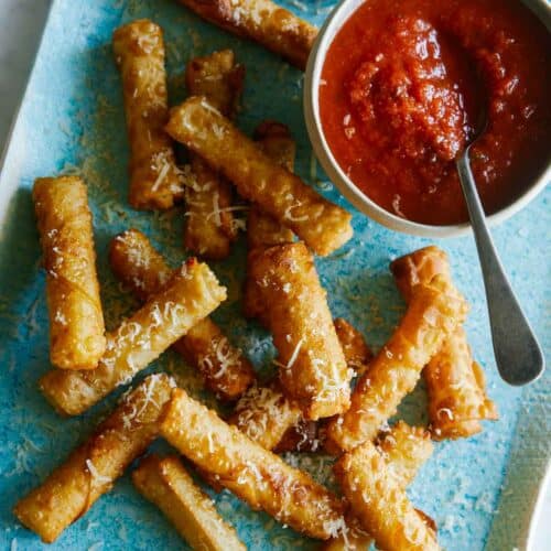 Mozzarella sticks with a marinara dipping sauce.