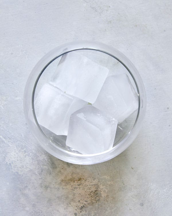 Cocktail glass with ice to make a shandy.
