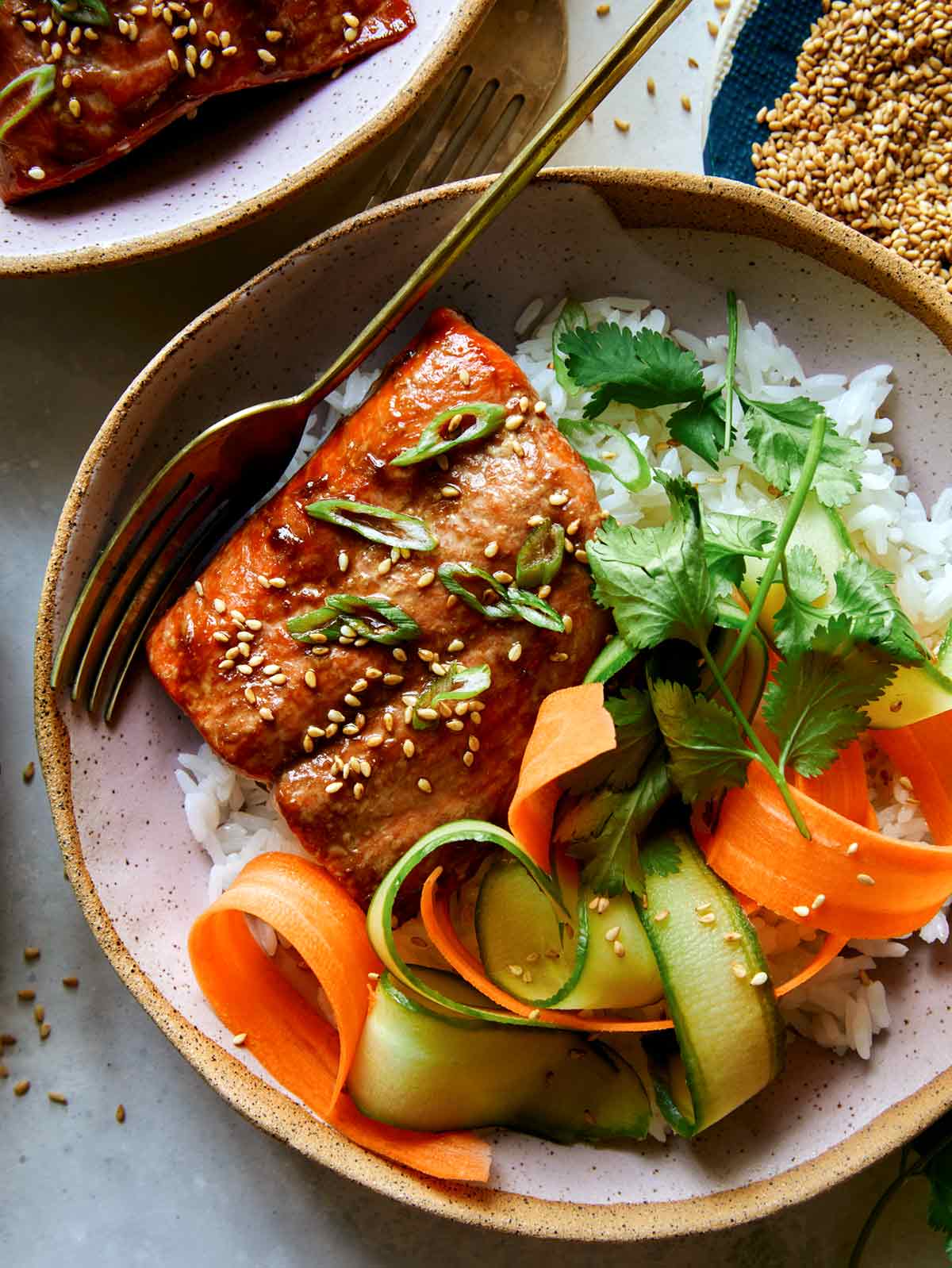 Teriyaki salmon recipe with a fork ready to eat. 