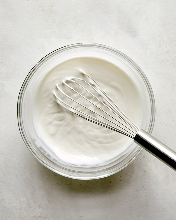 Whisking together ingredients to make buttermilk ranch.