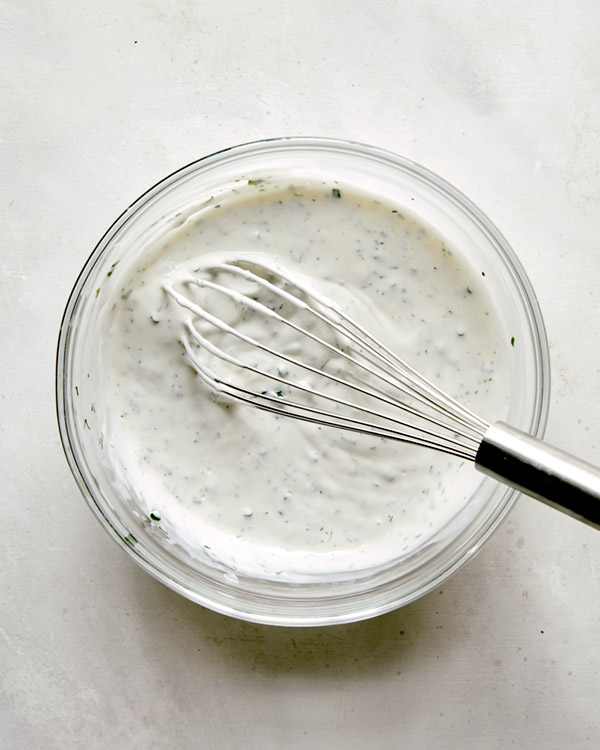 Freshly made buttermilk ranch dressing in a bowl.