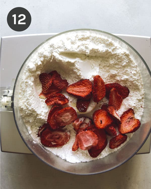 Freeze dried strawberries to make pink icing in a food processor.