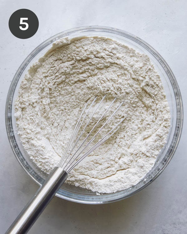 Dry ingredients being whisked together to make valentines cookies.