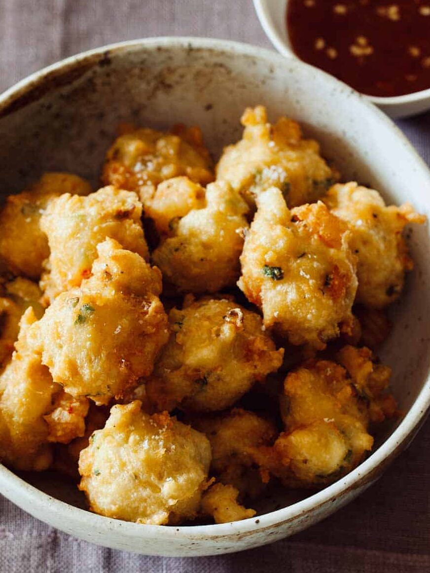 A recipe for Shrimp Fritters with a spicy honey drizzle, a Super Bowl snack.