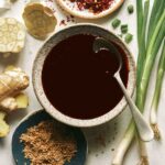 Teriyaki sauce recipe in a bowl with a spoon in it.