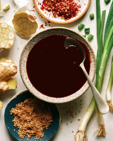 Teriyaki sauce recipe in a bowl with a spoon in it.