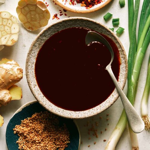 Teriyaki sauce recipe in a bowl with a spoon in it.