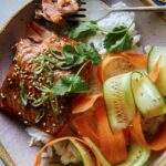 Teriyaki salmon recipe in a bowl with a fork.