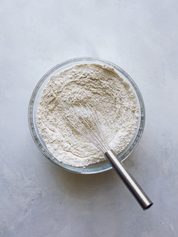 Whisking together dry ingredients to make Valentines Day cookies.