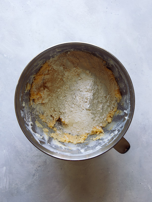 Flour mixture going into the cooking dough. 