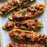 Close up on zucchini boats on a plate.