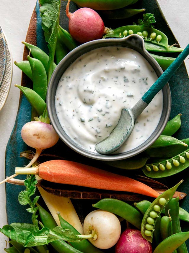 Ranch dressing served with vegetables.