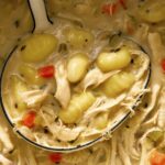 Chicken and gnocchi soup recipe with a ladle.