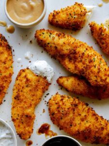 Air fryer chicken tenders with a variety of sauces.