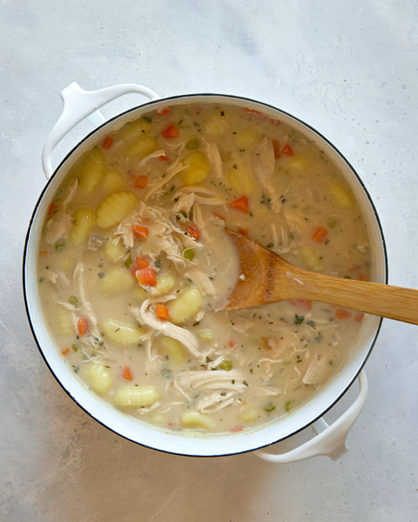 Chicken and gnocchi soup in a pot. 