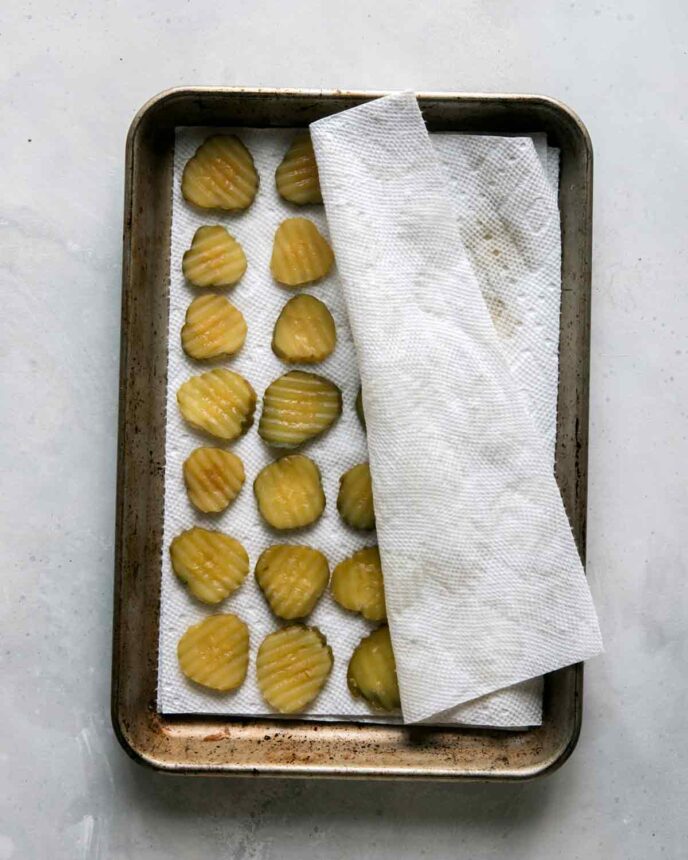 Pickle chips in a paper towel.