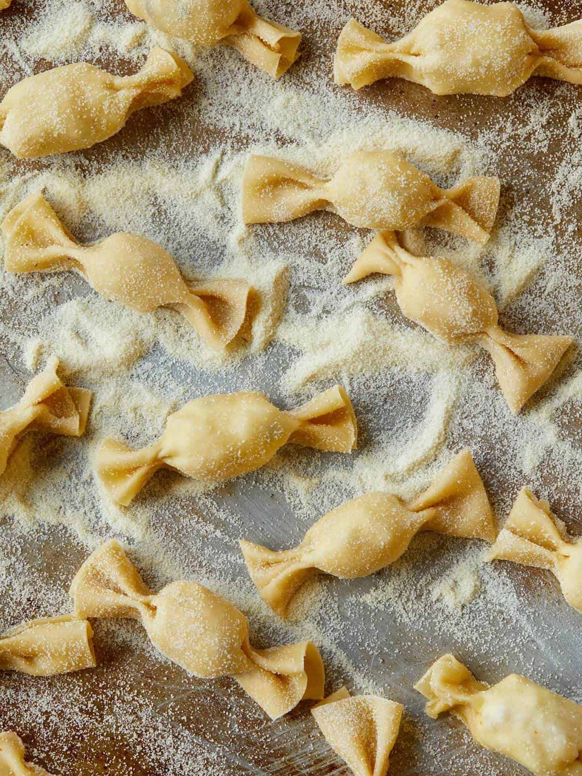 Raw lobster, corn, and tarragon caramelle in semolina flour.