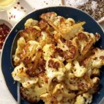 Roasted cauliflower recipe in a bowl.