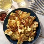 Roasted cauliflower recipe with wine on the side.