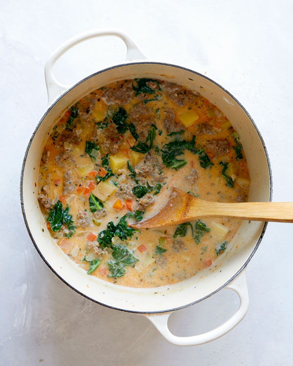 A stock pot full of Zuppa Toscana. 