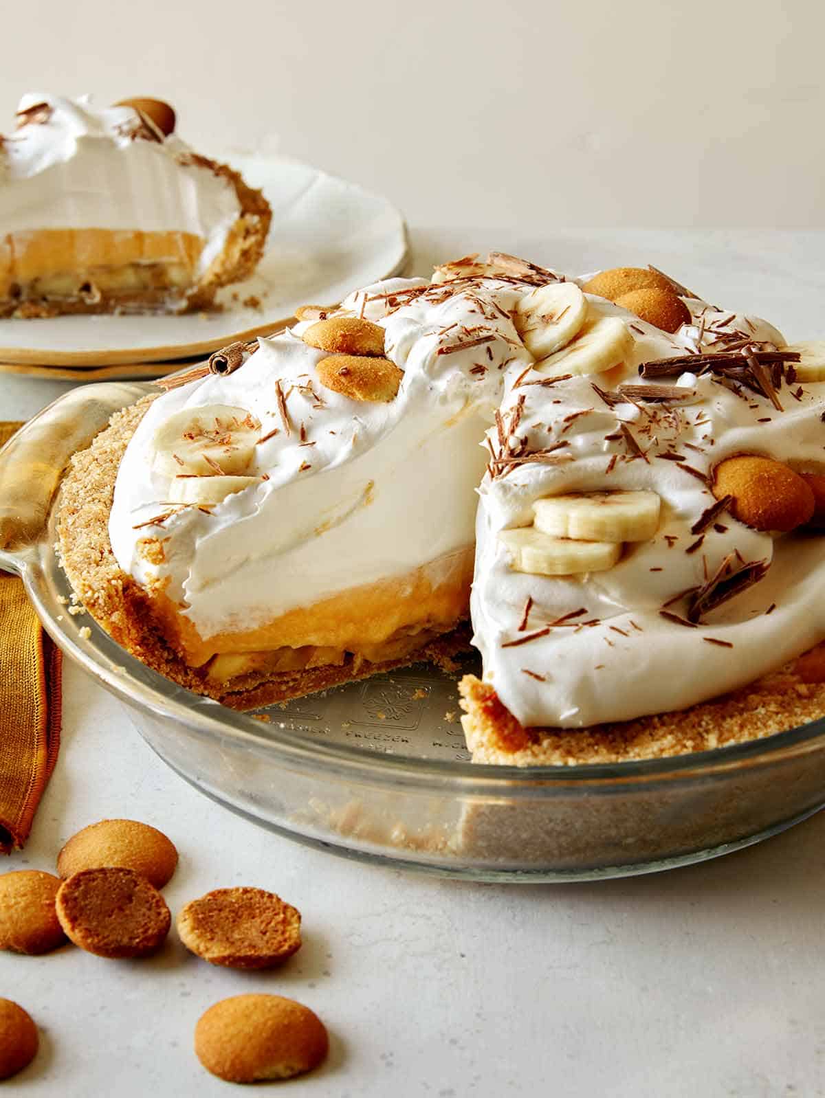 Banana cream pie recipe with a slice taken out.