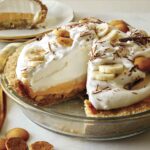 Banana cream pie recipe with a slice taken out.
