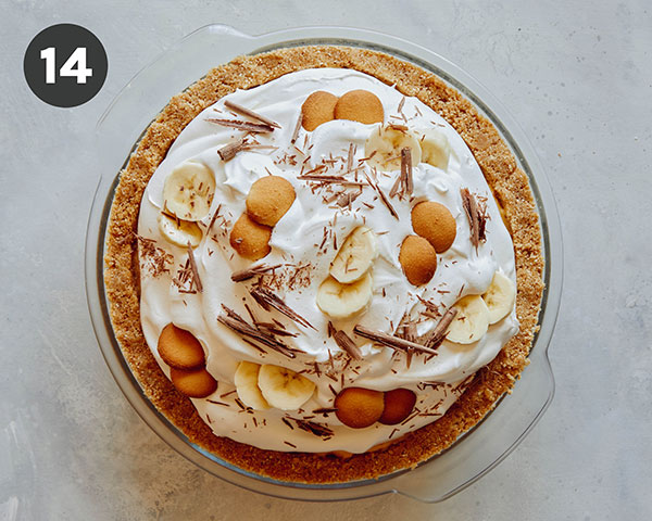 Banana cream pie finished on a kitchen counter. 