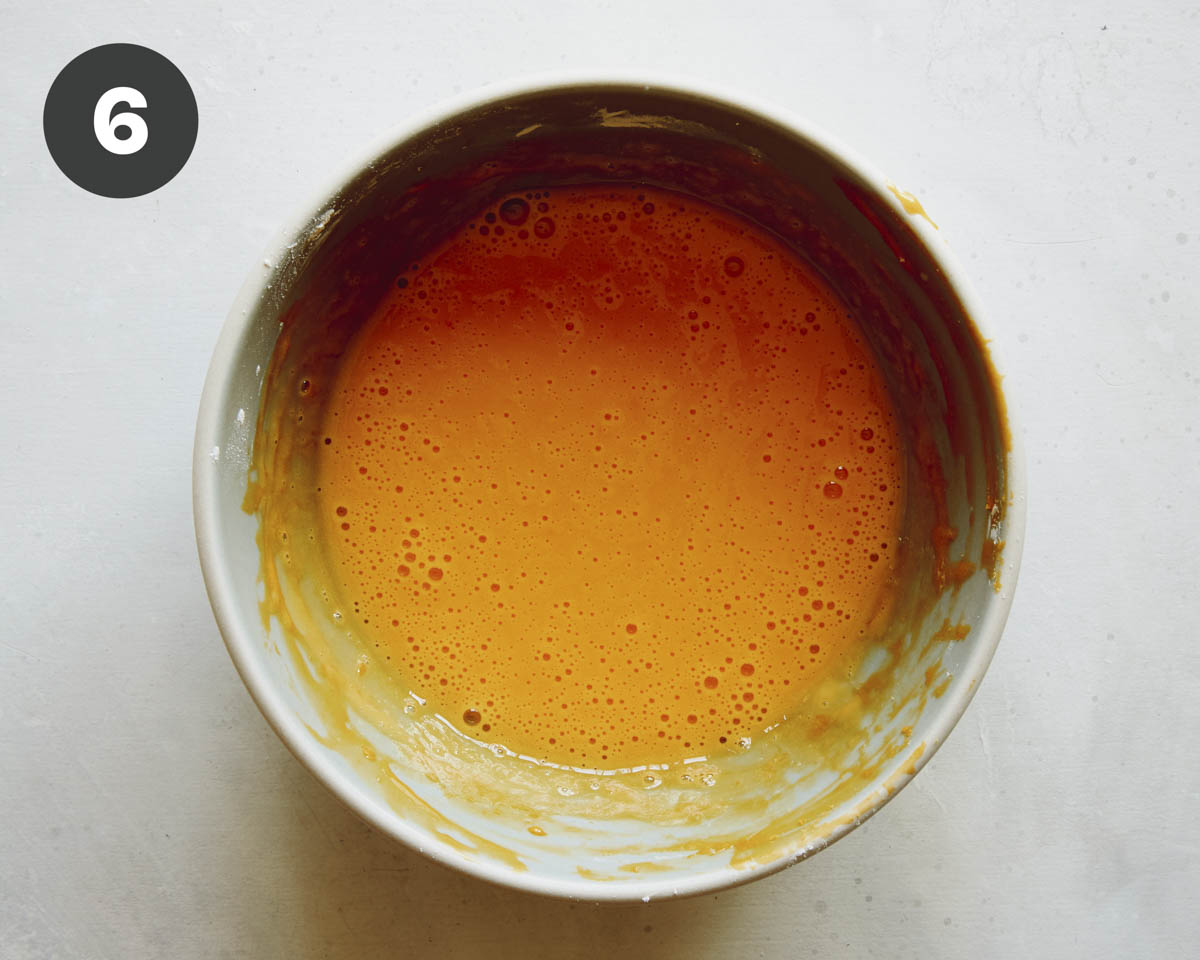Egg yolks in a bowl to make pudding.