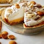 Banana cream pie recipe with a slice taken out.