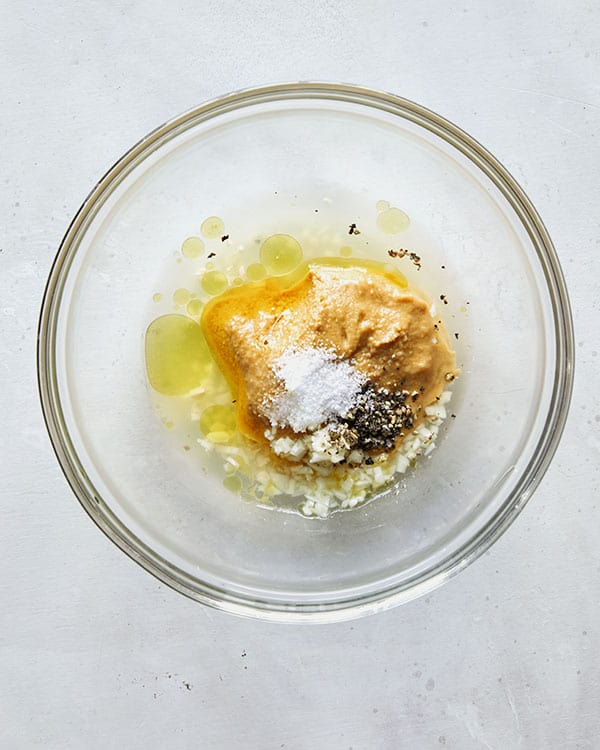 Chickpea dressing ingredients in a bowl.