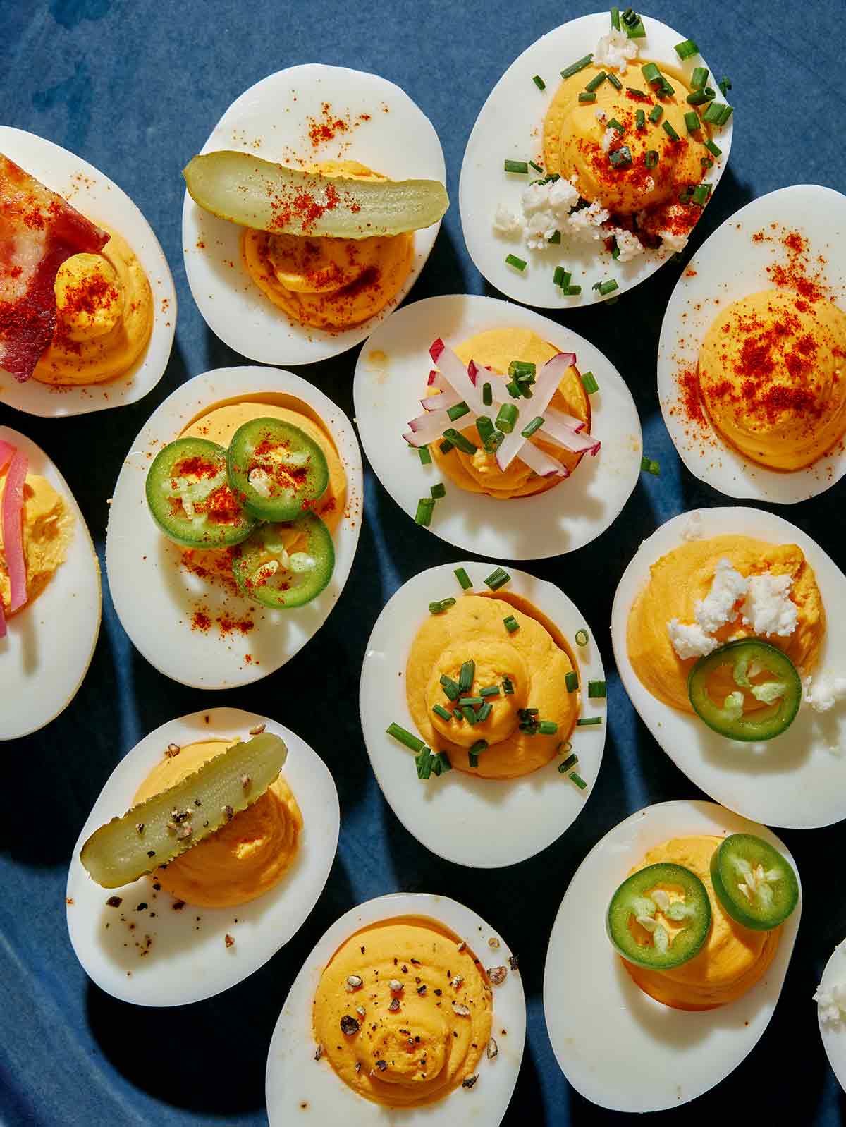 Easy deviled eggs recipe being placed on a platter. 