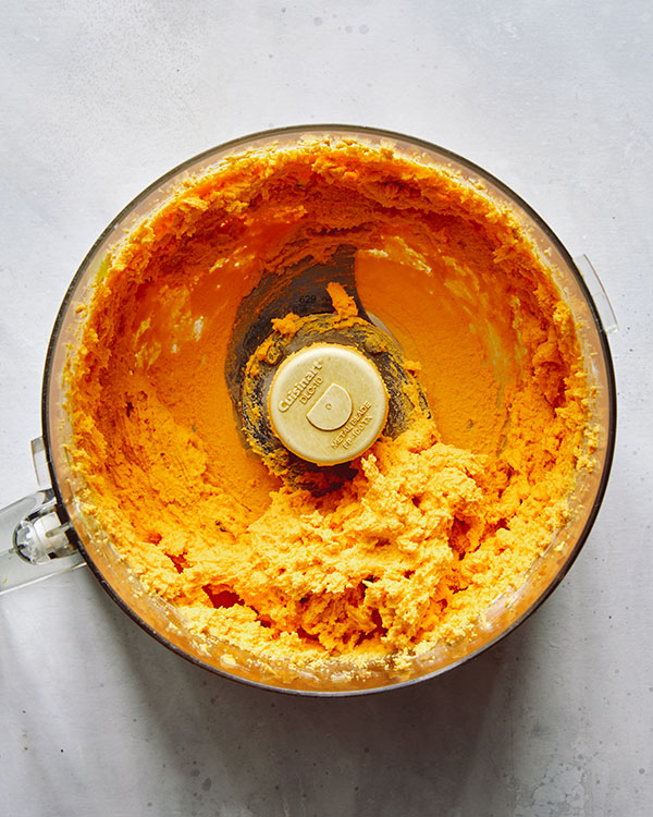 Deviled eggs filling in a food processor.