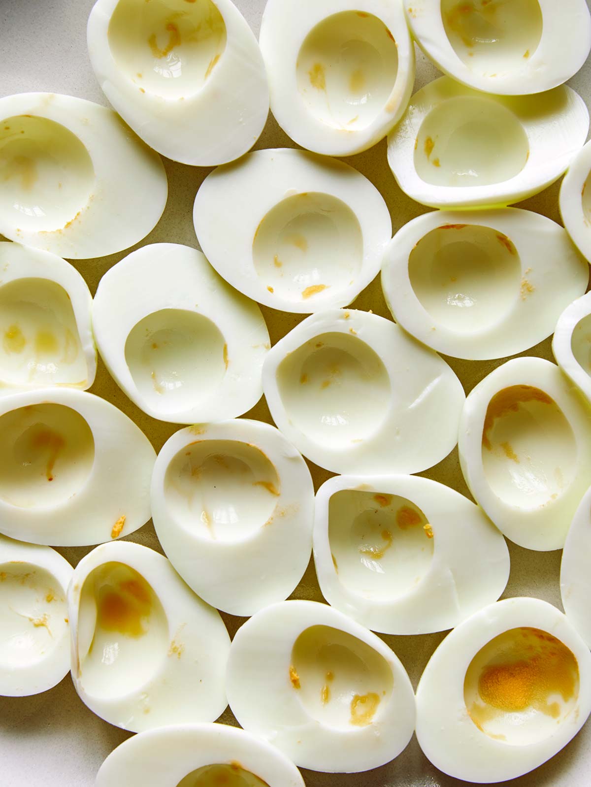 hard boiled eggs being prepped to make deviled eggs. 